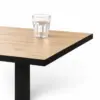 Cafétisch OMEGA 68x68 cm mit Holzoptik-Tischplatte und schwarzer Tischkante im Gastronomieeinsatz